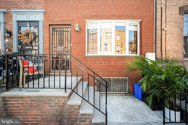 entrance to property with brick siding