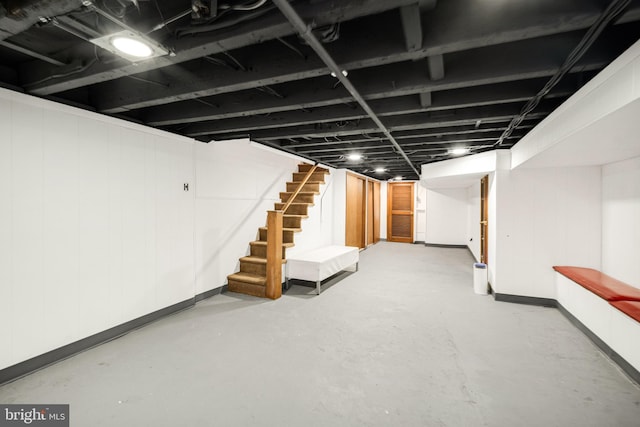 finished basement featuring stairs