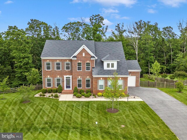 6451 Dresden Pl, Frederick, MD 21701 - view of front of home with brick siding, asphalt driveway, and an attached garage