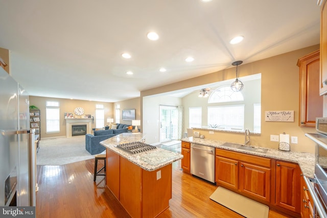 869 Bourban Ln, West Grove, PA 19390 - kitchen featuring appliances with stainless steel finishes, light wood-type flooring, light stone counters, and recessed lighting