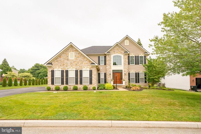 869 Bourban Ln, West Grove, PA 19390 - view of front of house with a front lawn and stone siding