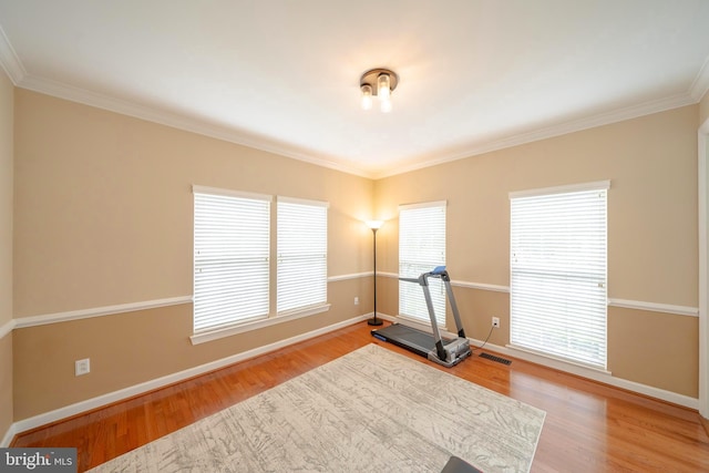 869 Bourban Ln, West Grove, PA 19390 - exercise room featuring ornamental molding and wood finished floors