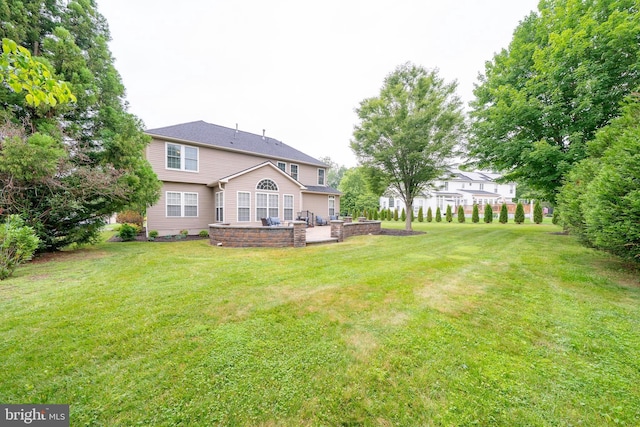 869 Bourban Ln, West Grove, PA 19390 - back of property with a lawn and a patio