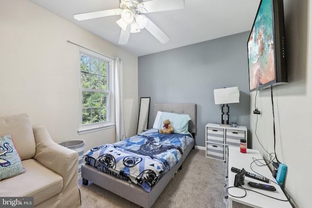 bedroom featuring baseboards, a ceiling fan, and carpet flooring