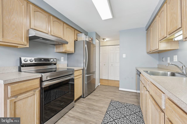 kitchen featuring under cabinet range hood, appliances with stainless steel finishes, and light brown cabinetry