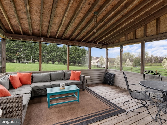 sunroom / solarium featuring an outdoor hangout area
