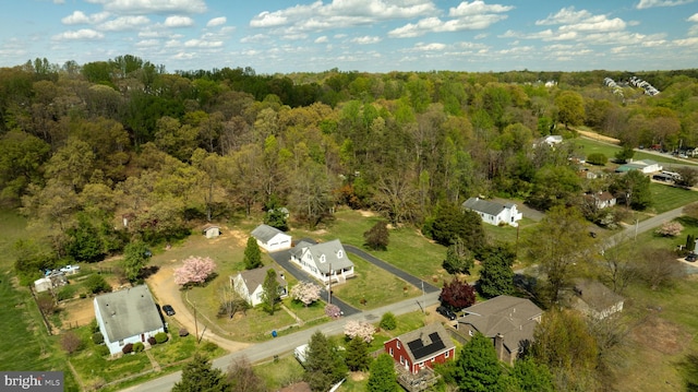 aerial view with a wooded view