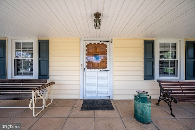 doorway to property with a porch