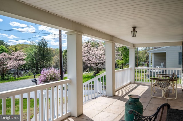 view of patio featuring a porch