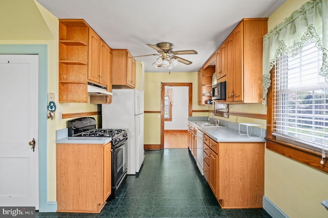 kitchen featuring a ceiling fan, open shelves, light countertops, under cabinet range hood, and black appliances