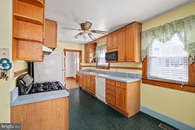 kitchen featuring open shelves, light countertops, ceiling fan, and black appliances