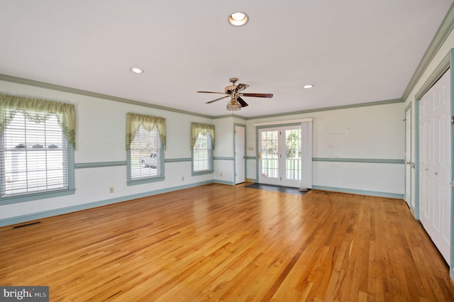 interior space featuring light wood-style flooring, baseboards, visible vents, recessed lighting, and crown molding