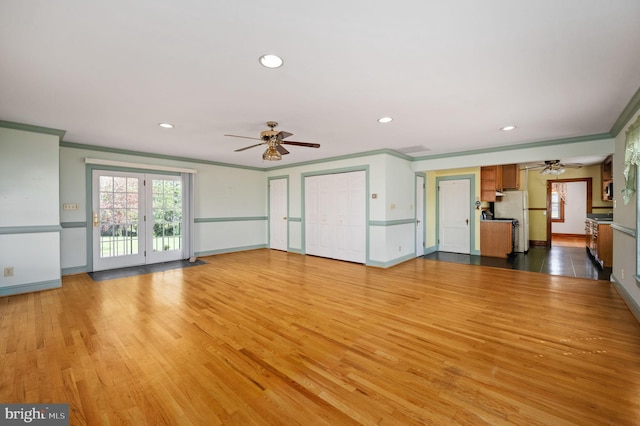 unfurnished living room featuring ceiling fan, wood finished floors, recessed lighting, and ornamental molding