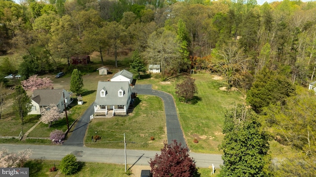 bird's eye view featuring a forest view