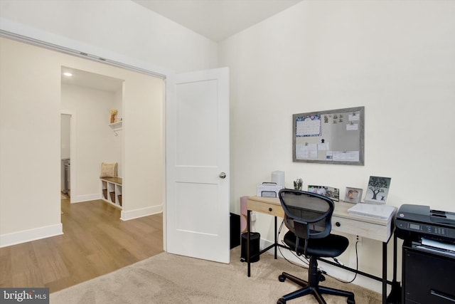 office area with wood finished floors and baseboards