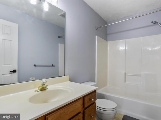 full bathroom with vanity, shower / tub combination, and toilet