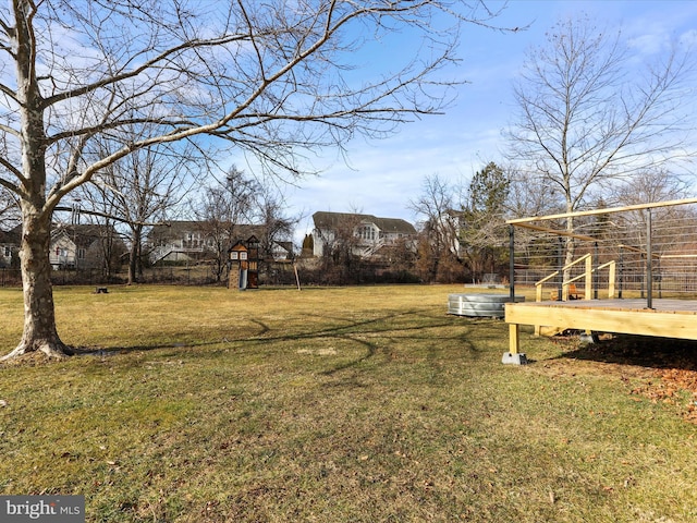 view of yard featuring playground community