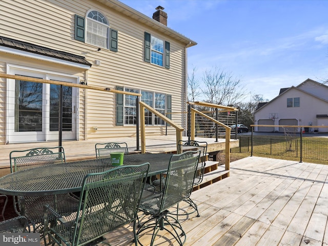 wooden terrace featuring outdoor dining space