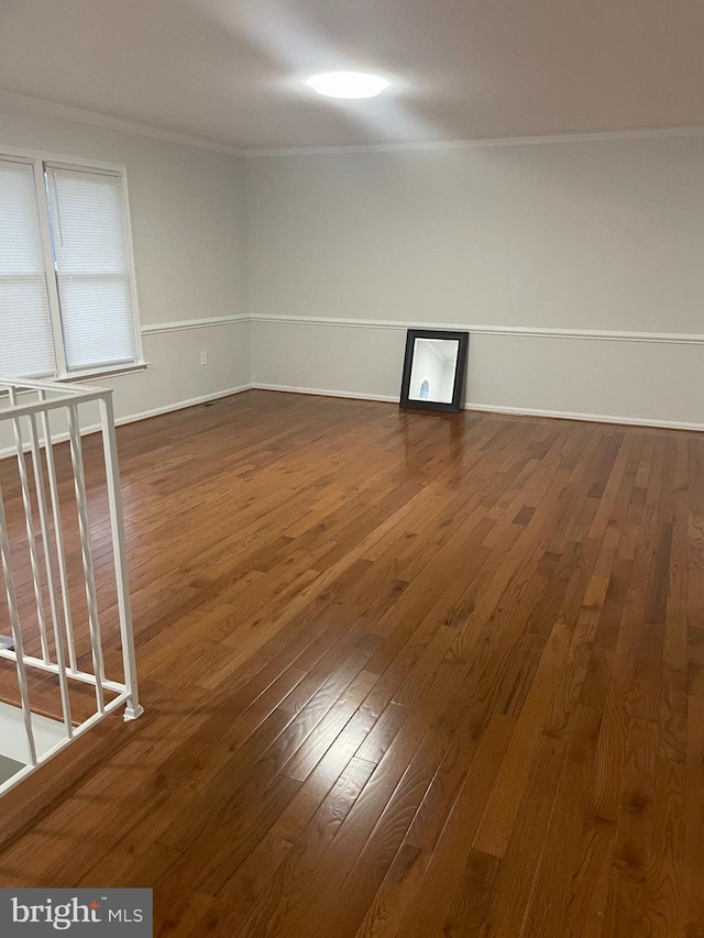 15712 Brandywine Rd, Dumfries, VA 22025 - empty room with crown molding, dark wood-style flooring, and baseboards