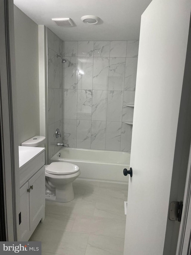 15712 Brandywine Rd, Dumfries, VA 22025 - full bathroom with vanity, marble look tile flooring, shower / tub combination, and toilet