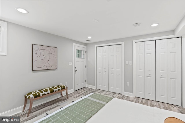 foyer featuring recessed lighting, baseboards, and light wood-type flooring