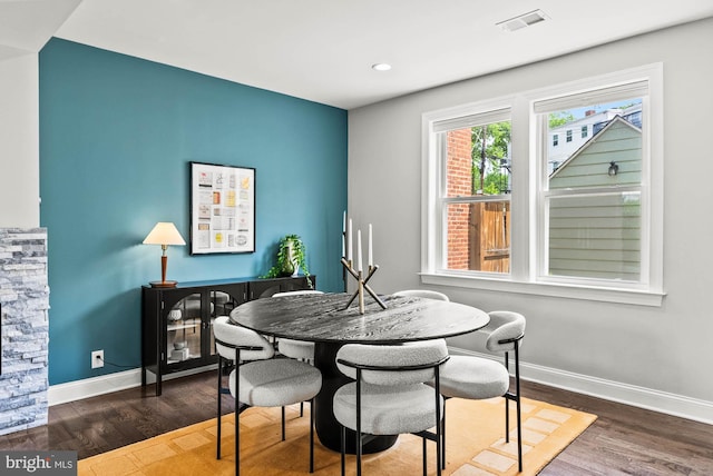 dining area featuring baseboards, recessed lighting, wood finished floors, and visible vents