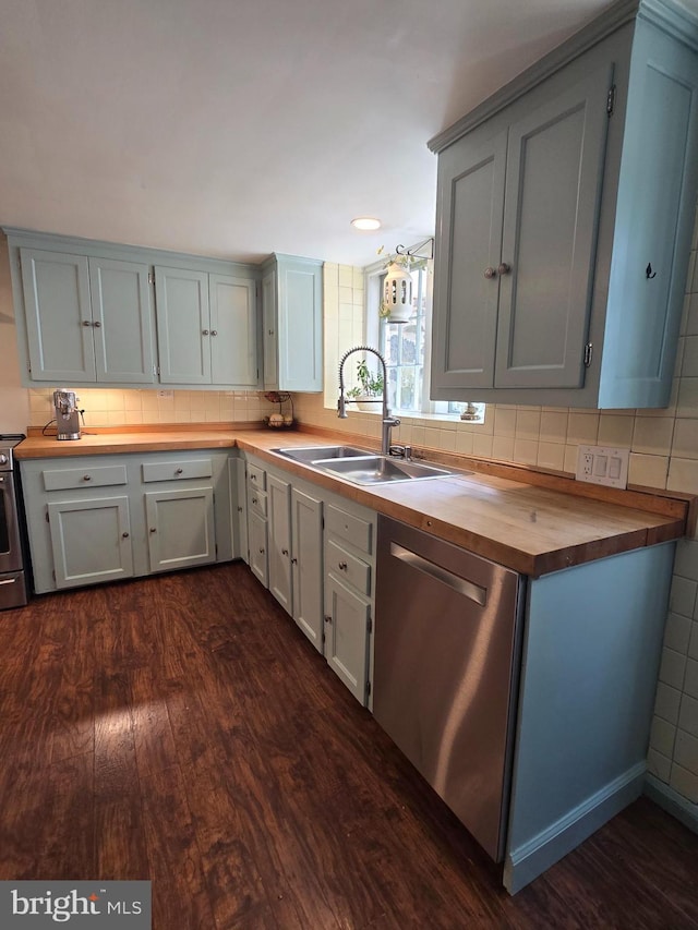 2531 Pickwick Rd, Baltimore, MD 21207 - kitchen with stainless steel appliances, dark wood-style floors, a sink, and butcher block counters