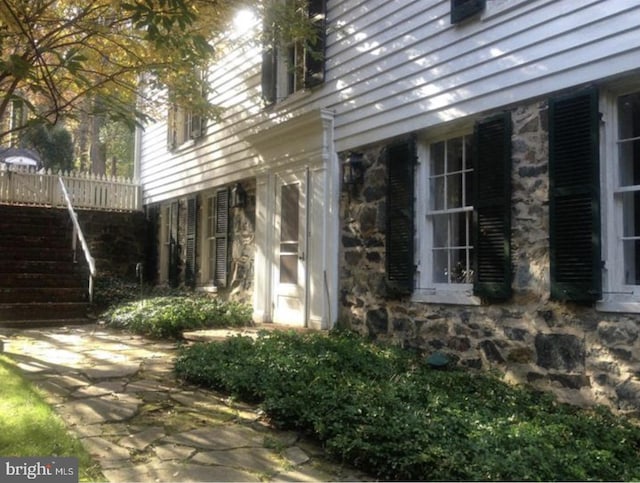 2531 Pickwick Rd, Baltimore, MD 21207 - view of side of home with stone siding and stairs