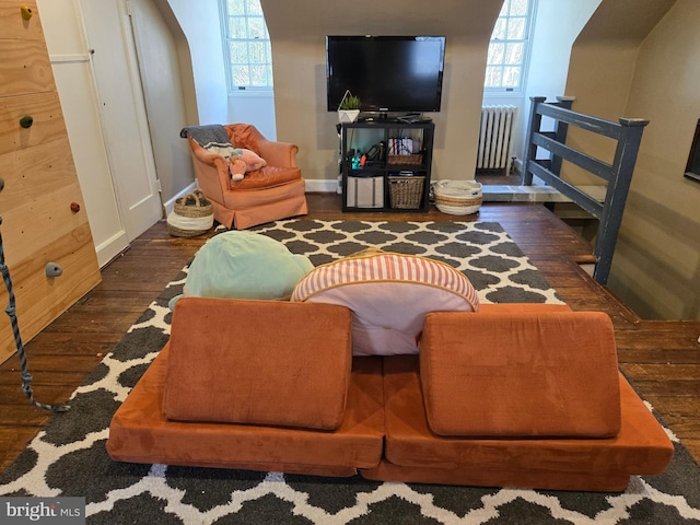 2531 Pickwick Rd, Baltimore, MD 21207 - living room with a wealth of natural light, radiator heating unit, wood finished floors, and baseboards