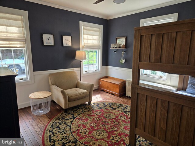2531 Pickwick Rd, Baltimore, MD 21207 - living area with hardwood / wood-style flooring, a ceiling fan, baseboards, and crown molding