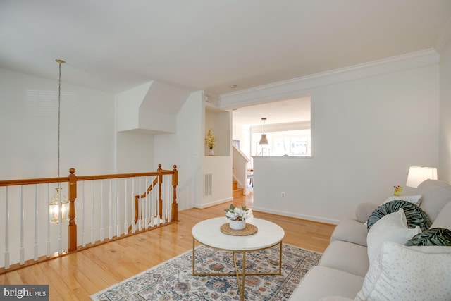 8114 Rainwater Cir, Manassas, VA 20111 - living area featuring wood finished floors, visible vents, crown molding, and baseboards
