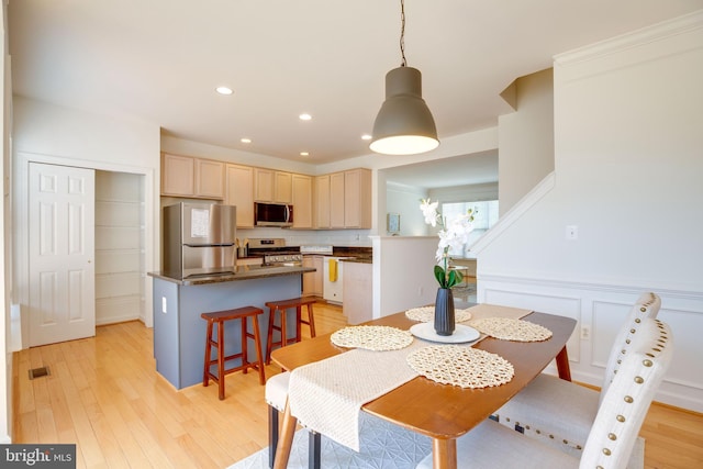 8114 Rainwater Cir, Manassas, VA 20111 - dining space featuring wainscoting, recessed lighting, visible vents, and light wood-style flooring