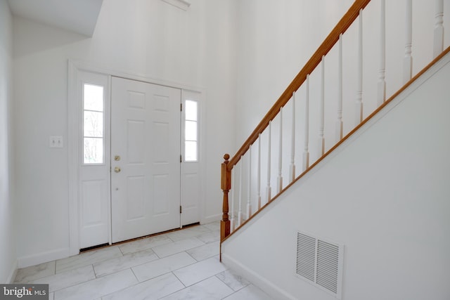 8114 Rainwater Cir, Manassas, VA 20111 - foyer with baseboards, stairs, and visible vents