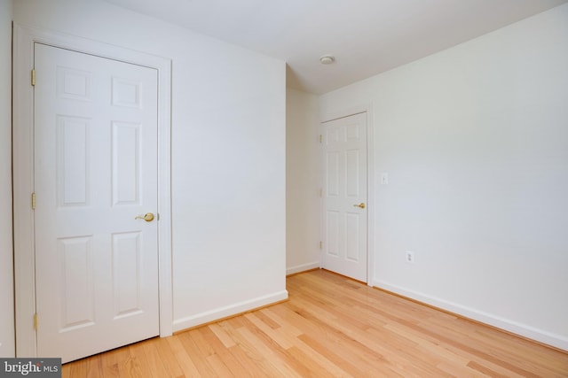8114 Rainwater Cir, Manassas, VA 20111 - unfurnished bedroom featuring light wood-style flooring and baseboards