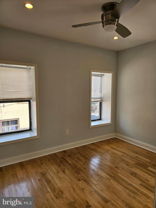 unfurnished room with wood-type flooring, baseboards, recessed lighting, and ceiling fan
