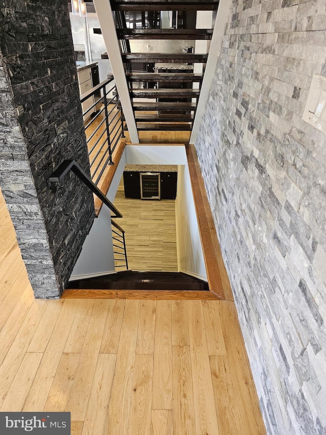 stairway featuring hardwood / wood-style flooring
