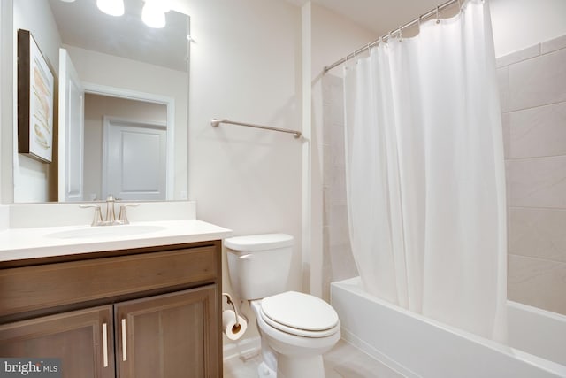 full bath featuring tile patterned flooring, shower / tub combo, toilet, and vanity