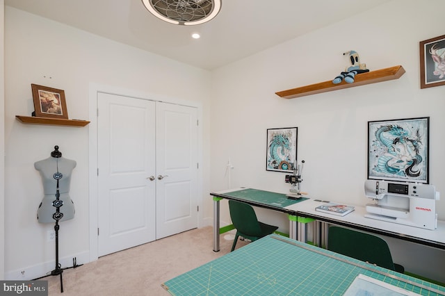 office area featuring light colored carpet and baseboards
