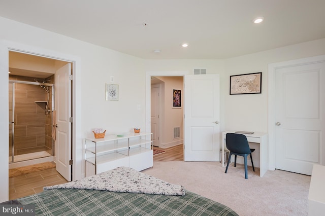 bedroom featuring visible vents, baseboards, recessed lighting, and light carpet