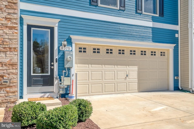 garage featuring driveway