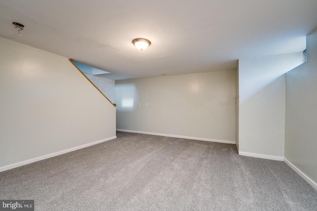 finished below grade area with carpet flooring and baseboards