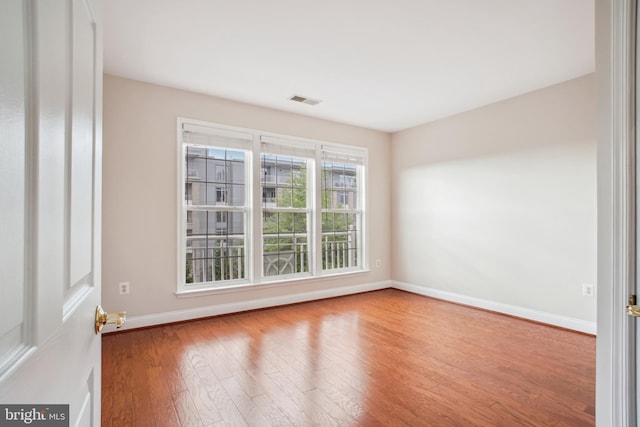 1625 Piccard Dr Unit 305, Rockville, MD 20850 - spare room featuring baseboards, wood finished floors, and visible vents