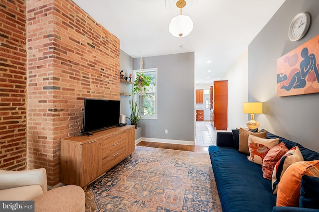 living area featuring wood finished floors and baseboards