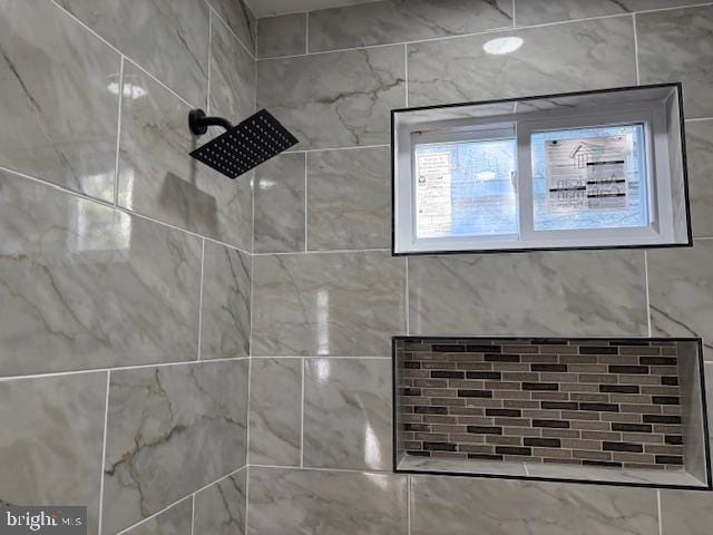 details featuring a tile shower
