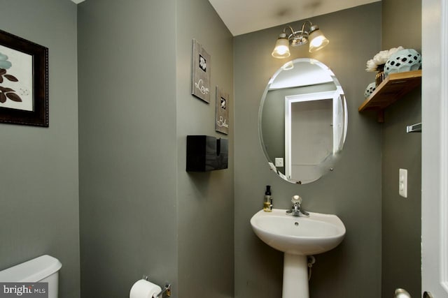 bathroom with a sink and toilet