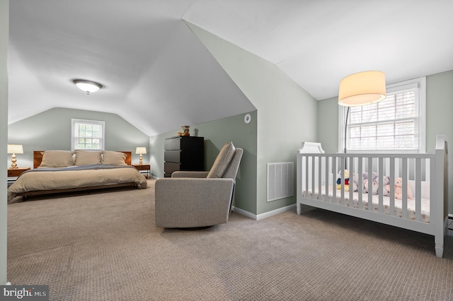 carpeted bedroom with baseboards, visible vents, and lofted ceiling