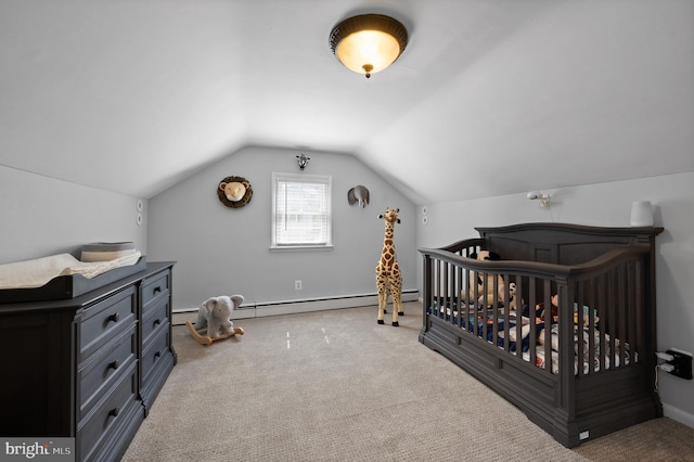 bedroom with baseboard heating, carpet flooring, and vaulted ceiling
