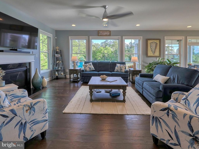 169 E Buckingham Dr, Rehoboth Beach, DE 19971 - living area featuring dark wood-type flooring, a ceiling fan, recessed lighting, a premium fireplace, and baseboards