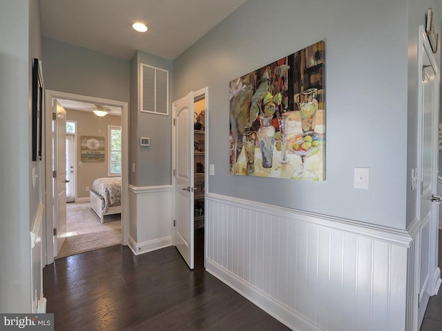 169 E Buckingham Dr, Rehoboth Beach, DE 19971 - hallway featuring wainscoting and dark wood-type flooring