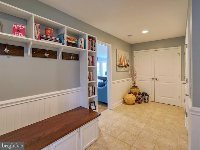 169 E Buckingham Dr, Rehoboth Beach, DE 19971 - mudroom with wainscoting, light tile patterned floors, and recessed lighting
